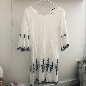 White dress with blue detail